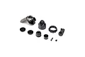 A collection of black plastic RC shock absorber parts including a shock cap, spring collar, pistons, and small mounting screws on a white background.