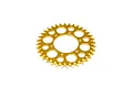A gold-anodized metal sprocket for an RC motorcycle, featuring a circular design with multiple lightening holes and gear teeth around the perimeter.