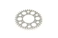 A silver-coloured metal RC motorcycle chain sprocket with multiple circular cutouts for weight reduction.