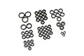 A collection of various sized rubber shielded ball bearings arranged in groups on a white background.
