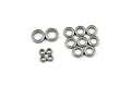 A collection of metal shielded ball bearings of varying sizes arranged on a white background.