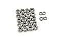 A collection of metal shielded ball bearings of various sizes arranged on a white background.