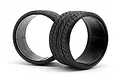 Two black HPI Racing 2.2 inch drift tyres with Dunlop Le Mans LM703 tread pattern isolated on a white background.
