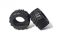 Two black HPI Racing monster truck tyres with aggressive tread patterns and foam inserts visible inside, set against a plain white background.