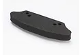 A black foam bumper for an RC car, featuring a curved shape and four mounting holes, isolated against a white background.