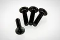 Four black metal button head screws with Phillips drive heads arranged on a white background.