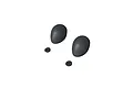 Two matte black unpainted RC driver helmet shells and two small circular mounting washers on a white background.