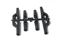 A black plastic parts tree containing four suspension arm or tie rod components for an HPI RC vehicle.