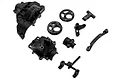 A set of black plastic Axial RC chassis components including transmission housing parts and suspension links on a white background.