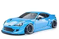 A light blue MST RMX 2.5 86RB RC drift car, 1/10 scale, shown from a front three-quarter angle against a white background.