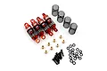 A set of four red aluminium RC shock absorbers with black springs, brass spacers, screws, and O-rings on a white background.