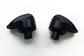 Two black plastic UDI hatch cover locking switches for an RC boat, shown side by side against a white background.