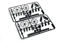 Two identical black plastic parts trees for an RC car, each containing circular wheels and various small components on a white background.