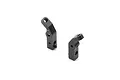 Two black anodized aluminium rear shock mounts for an XRAY RC car, shown from an angled perspective against a white background.