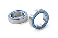 Two metal ball bearings with blue rubber seals isolated on a white background.