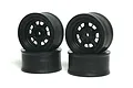Four black RC car wheels stacked in two pairs against a white background.