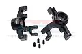 Two black aluminium RC steering hubs with four small grub screws on a white background.