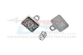 Two silver metal RC brake pads with friction material and a small coil spring against a white background with a faint GPM Racing logo watermark.