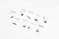 A collection of small plastic bags containing various black RC screws, each labeled with handwritten size specifications on a white background.