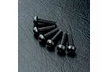 A set of six black metal button head screws with hex sockets arranged on a textured black surface.