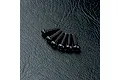 Six black button head screws with hex drive sockets arranged on a textured black surface.