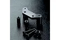 MST black aluminium steering arm mount with two spacers and four flat-head hex screws on a black textured surface.