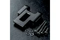 A black aluminium MST rear upper deck connector with four matching screws and four washers on a textured black surface.