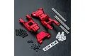 MST red aluminium rear lower suspension arm set including metal pins, screws, plastic bushings, and MST logo stickers on a black textured surface.