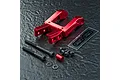 MST red aluminium integrated upper deck connector set with included screws, washers, and a small MST decal sheet on a textured black surface.