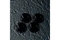 Four black MST lightweight aluminium low profile shock bottom caps arranged on a dark textured surface.