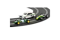Three Scalextric Jim Clark collection slot cars racing on a curved track section.