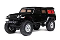 A black Axial SCX24 Jeep Gladiator RC rock crawler shown from a front three-quarter angle against a white background.