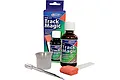 Deluxe Materials Track Magic cleaning kit including a 50ml bottle, applicator, sponge, and measuring cup in its original packaging.