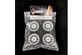 A set of four Solaris Mini 28J premounted RC touring car tyres with white multi-spoke rims, sealed in a clear plastic retail bag with a header card.