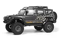 A studio shot of the HPI Venture Wayfinder 1/10 scale RC rock crawler in grey, featuring a roof rack, spare tire, and off-road tires.