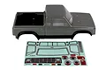 A grey Element RC Sendero 1/10 scale crawler body shell with a black bed and wheel arches, displayed with a decal sheet below it.