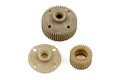 Team Associated differential and idler gear set components made of tan plastic, including a main gear, a cover plate, and a smaller idler gear.