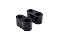 Two black RC Maker rear body mount spacers with two holes each, shown against a white background.