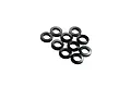 A cluster of ten small, black circular shims or washers arranged on a white background.