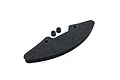 A black foam RC car bumper with two small rubber grommets or spacers positioned above it against a white background.