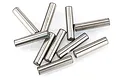 A collection of ten small, cylindrical metal drive pins scattered on a white background.