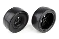 Two Team Associated rear drag racing wheels with black rims and slick rubber tyres, shown from front and back angles on a white background.