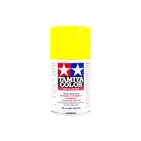 A 100ml can of Tamiya TS-16 Yellow lacquer spray paint for plastic models, featuring the Tamiya logo and safety warnings on a white background.