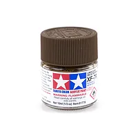A small glass jar of Tamiya XF-79 Linoleum Deck Brown acrylic paint with a brown ribbed plastic cap against a white background.