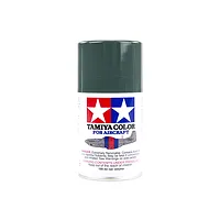 A 100ml can of Tamiya AS-21 Dark Green 2 (IJN) spray paint for aircraft models, featuring the Tamiya logo and an illustration of a fighter plane.