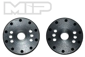 Two black circular MIP shock pistons with multiple holes arranged in a pattern, shown against a white background.
