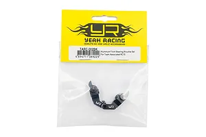 Yeah Racing black aluminium steering knuckles for Team Associated RC10 in original yellow and clear plastic packaging.