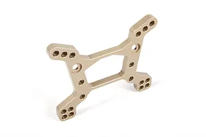 A gold-anodized aluminium front shock tower for an RC vehicle, featuring multiple mounting holes for suspension adjustment.