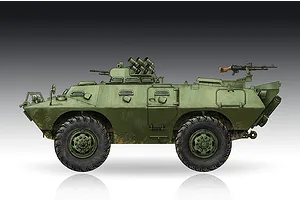 A side-profile digital illustration of an M706 Commando armoured car in olive green, featuring large tires, a turret with smoke launchers, and a rear machine gun.