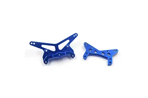 Two dark blue anodized aluminium RC shock towers for front and rear suspension, featuring multiple mounting holes for adjustment.